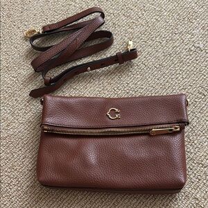C. Wonder Brown Crossbody Bag with Supple Leather and Versatile Design